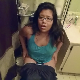 A chubby, mixed Asian-looking girl wearing glasses records herself straining, shitting and pissing while sitting on a toilet then wiping herself. Audible plop sounds. No product shown. Presented in 720P HD. About 3.5 minutes.